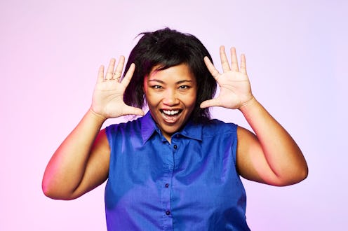 Happy woman waving her hands