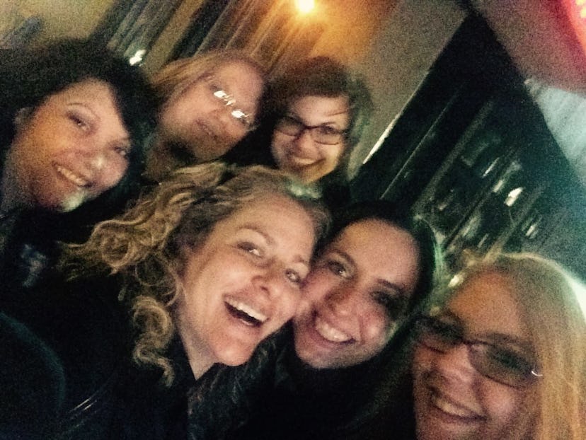 Jill Smokler taking a selfie while smiling and surrounded by 5 friends