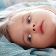 Little girl laying in bed