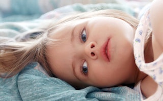 Little girl laying in bed