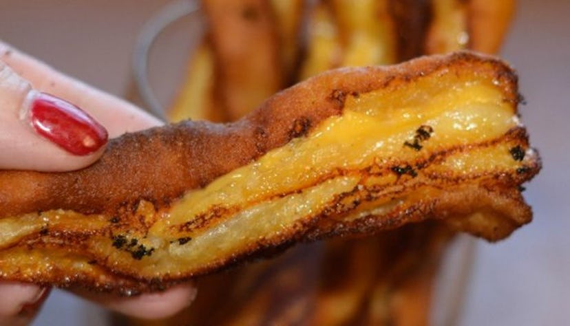 A person is holding a grilled cheese fries in one hand on the list of the 10 great recipes for busy ...