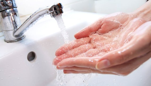 A mother with OCD trying to perfectly wash her hands