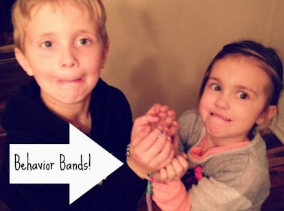 Two children with their hands binded together with a Rainbow Loom rubber band repurposed as Behavior...