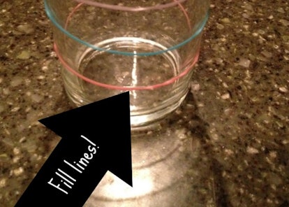 Rainbow Loom rubber bands placed on a glass, repurposed as Fill Lines to easily "say when."