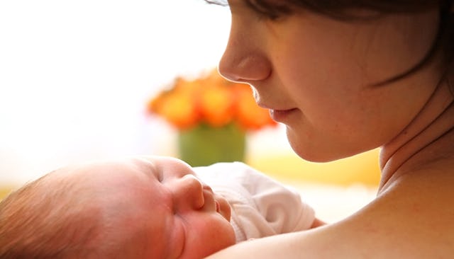 A mother breastfeeding her child
