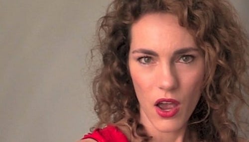 A portrait of a mother with a surprised look, looking at the camera.