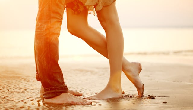 Man and woman standing in a shallow on a date