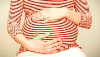 A woman's belly in the ninth month of pregnancy 