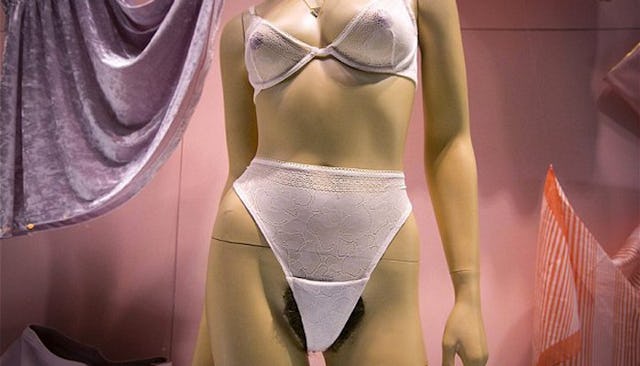 Plastic mannequin wearing white lingerie