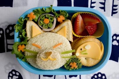 Salad and bread meal served as a cat in a lunch box