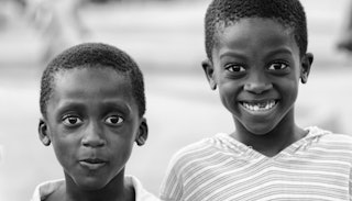 Two black boys smiling 