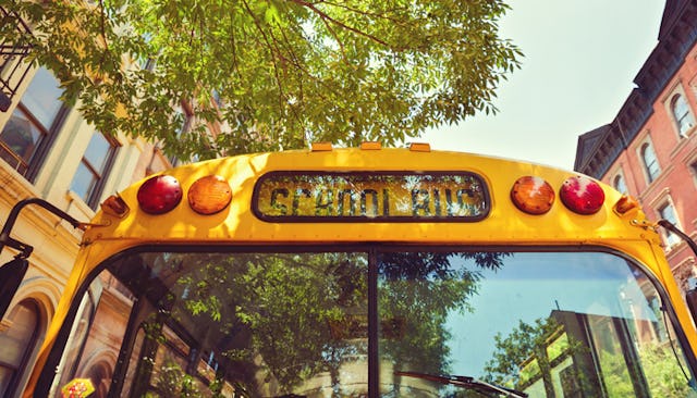 A close-up of the front side of a yellow school bus