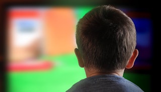 A child sitting and watching TV