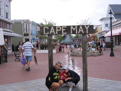 Kids posing in front of a Cape May sign in New Jersey