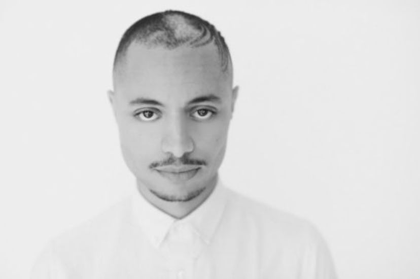 Jose James wearing a white shirt in black and white