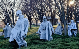 The stainless steel sculptures of fighting men on patrol in the Korean War Veterans Memorial. 