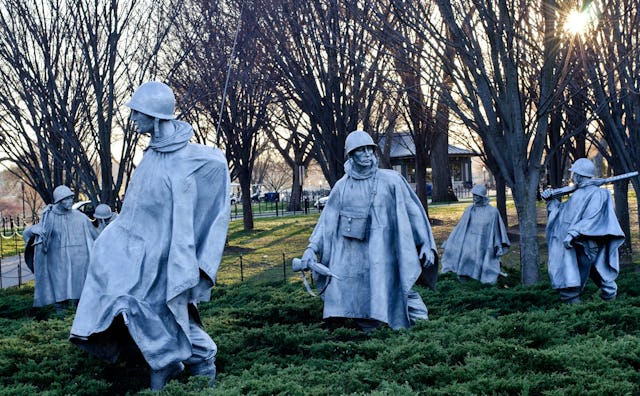 The stainless steel sculptures of fighting men on patrol in the Korean War Veterans Memorial.