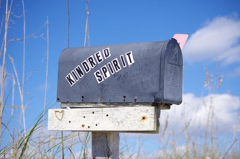 A mail box that has words "Kindred spirit" on it