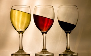 Three half-full wine glasses
