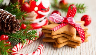 Christmas cookies with red decorations and a candy cane 