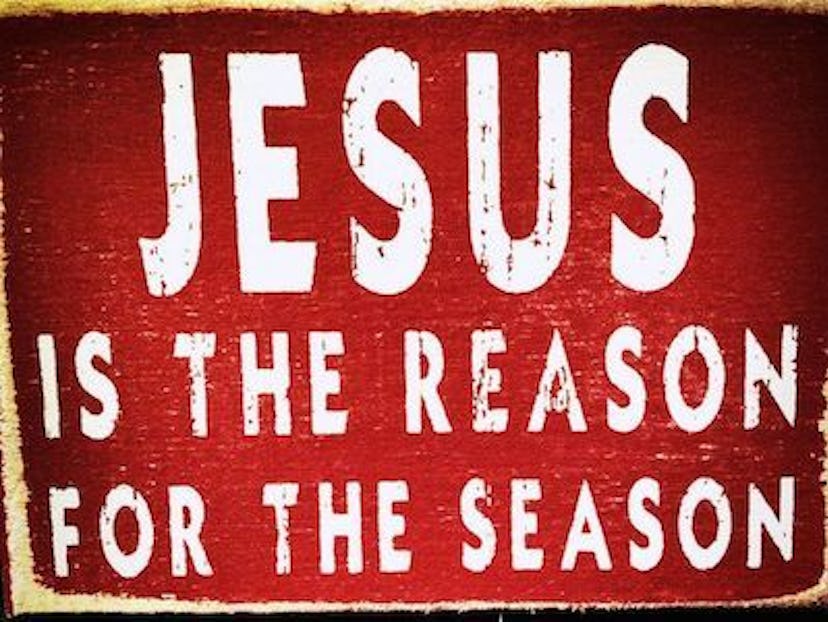 "JESUS IS THE REASON: FOR THE SEASON" white text on a red surface