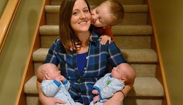 A mom and her three kids sitting on the stairs showing how it is to live with lissencephaly