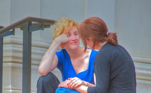 A woman comforting her friend going through a divorce