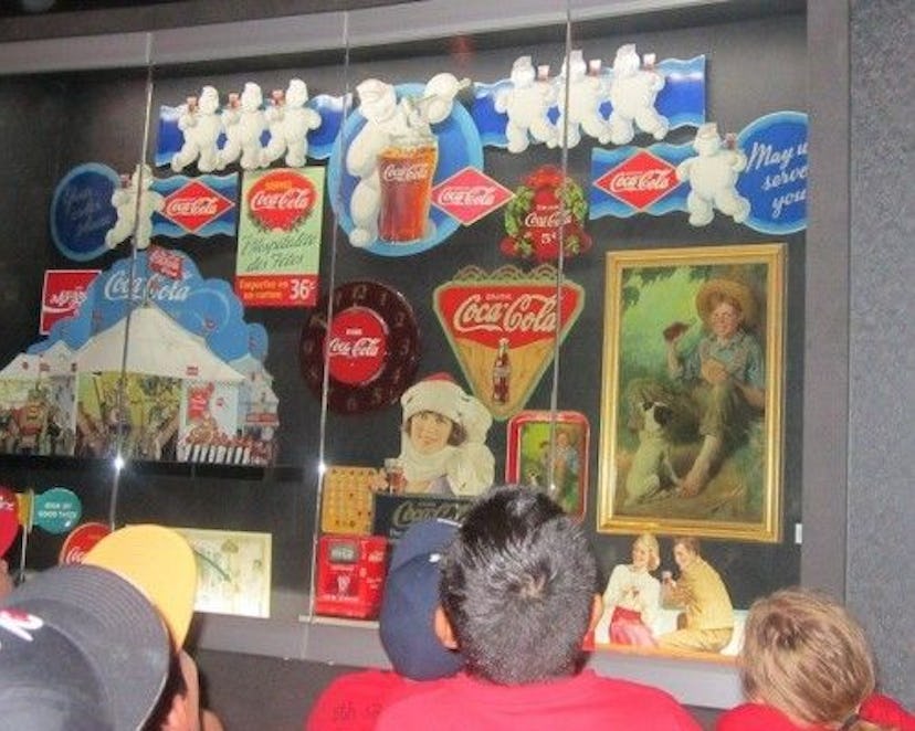 A group of visitors watching a display in The World of Coke in Atlanta