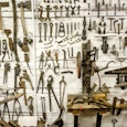 A white wall full of tools for a shop clas