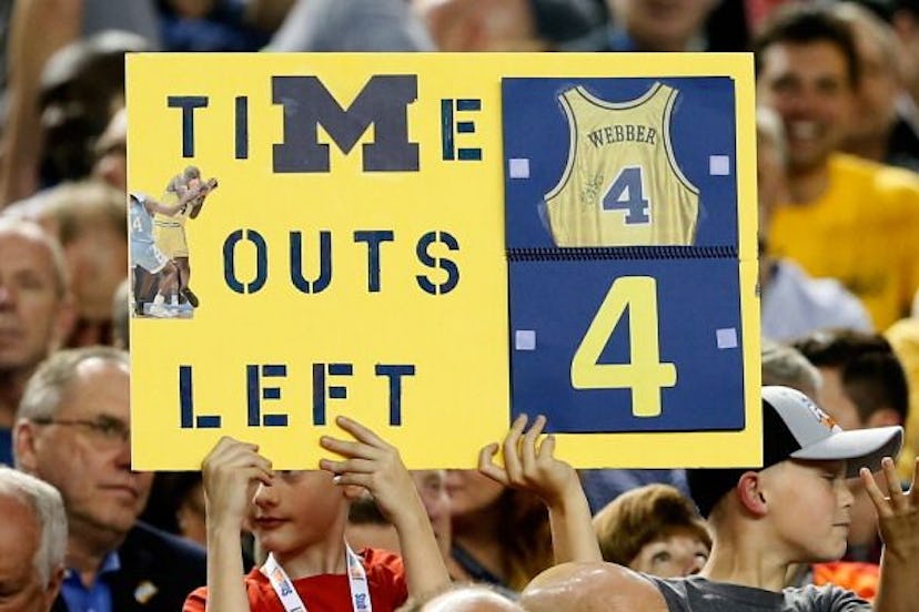 Crowd Holding Up A Sign That Counts Time Outs After Chris Webber's Mistake At The NCAA Championship ...