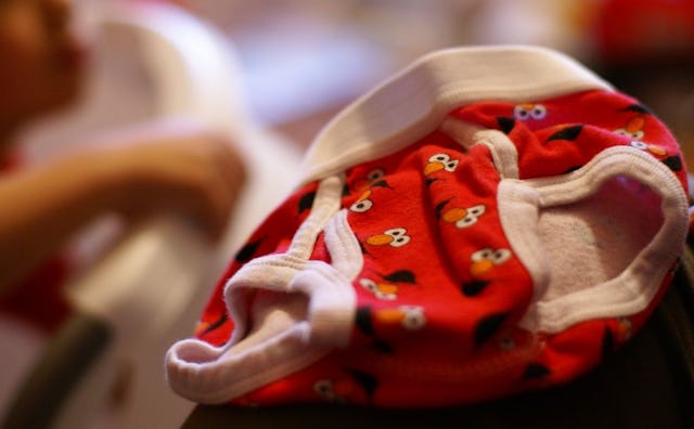 A pair of red kids' underwear with print depicting Elmo from The Muppet's Show