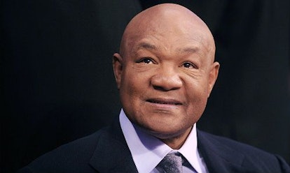 George Foreman wearing a black suit