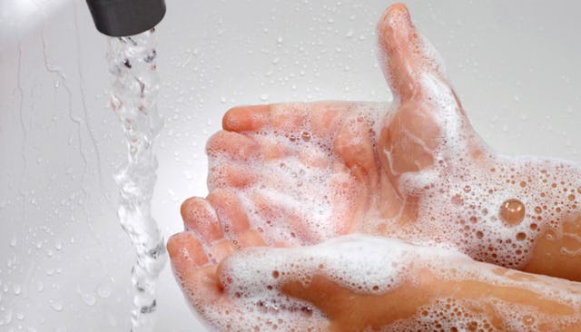 A child washing his hands in the bathroom