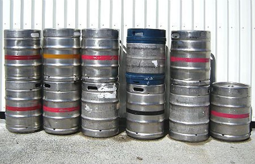 Eleven grey beer kegs