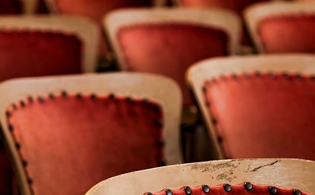 A close-up of red-brown chairs
