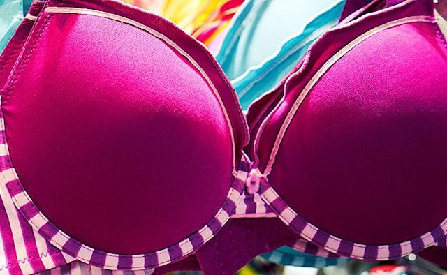 A pink bra with pink and white stripes on sides.