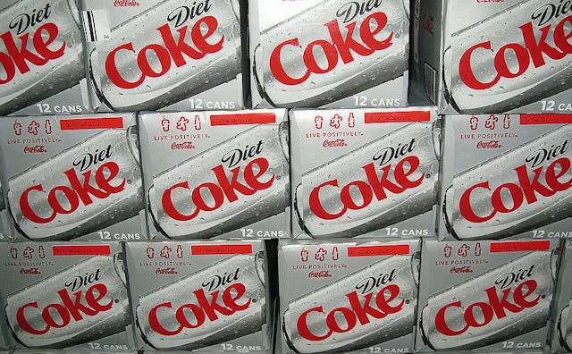 A stack of Diet Coke card boxes as a symbol of diet coke addiction 