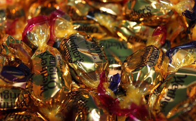 A pile with a lot of Werther's Original candies with a golden wrap
