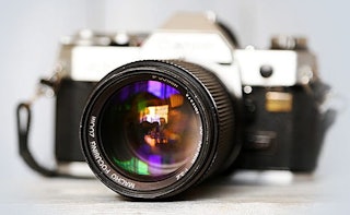 A photo camera with a large lens