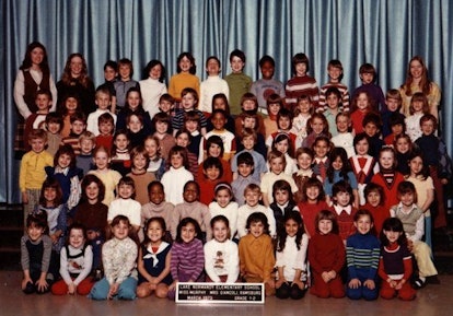 Group photo of the 1971 graduating class from Potomac, Maryland, featuring them alongside their teac...