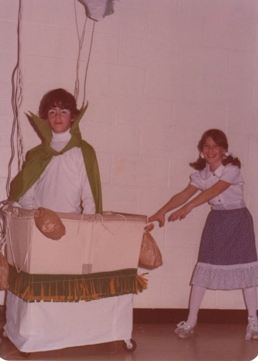 A girl and a boy with an improvised stroller playing the Wiz and Dorothy in a sixth grade show at La...