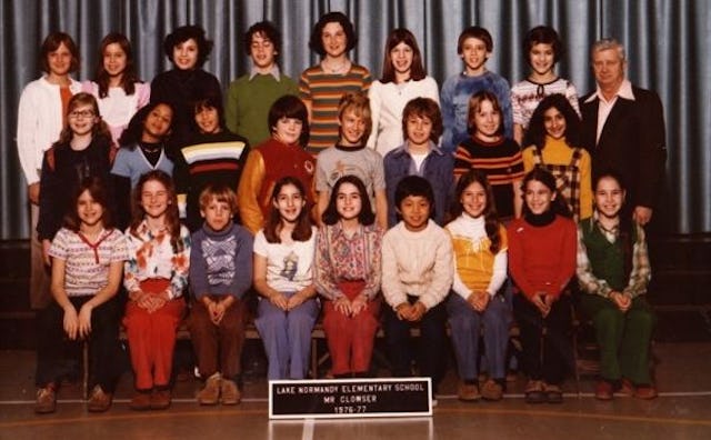 Group photo of the 1971 graduating class from Potomac, Maryland, featuring them alongside their teac...