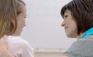 A mother comforting her crying kid 