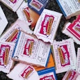 A bunch of Box Tops packages stacked up in one place