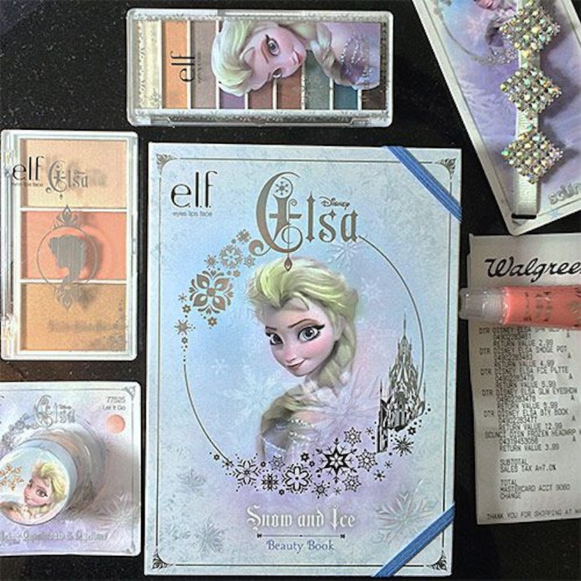 Elsa from Disney's 'Frozen' makeup products placed next to each other on a black surface