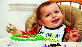 A happy baby boy celebrating his first birthday