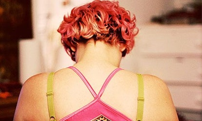 A woman wearing a A pink C9 sports bra