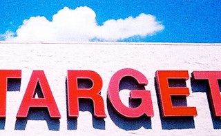 A large red Target sign standing on a white building 