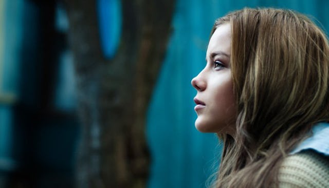 A teenage girl looking into the distance