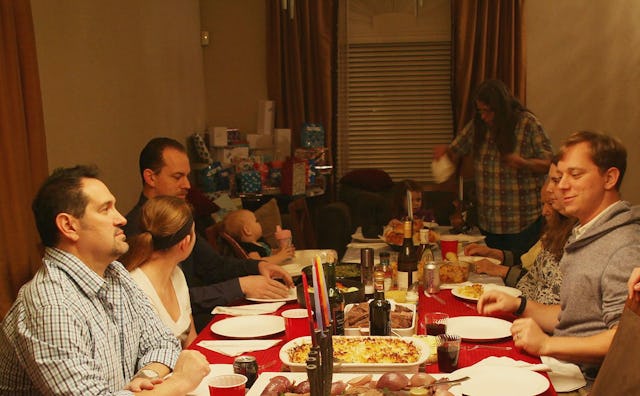 A family gathered for dinner at the grownup table 